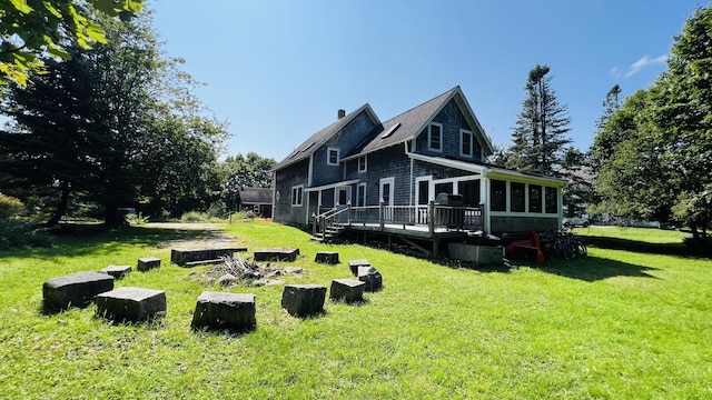 103 Water St, Machias, ME 04654 - rear view of property with a deck, a yard, and a chimney