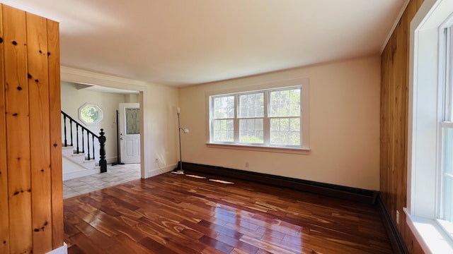 103 Water St, Machias, ME 04654 - unfurnished room with hardwood / wood-style flooring, a baseboard radiator, stairway, and baseboards