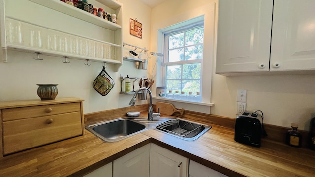 103 Water St, Machias, ME 04654 - kitchen with wood counters, a sink, white cabinetry, and open shelves