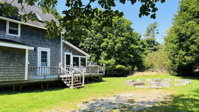 103 Water St, Machias, ME 04654 - view of green lawn featuring a wooden deck