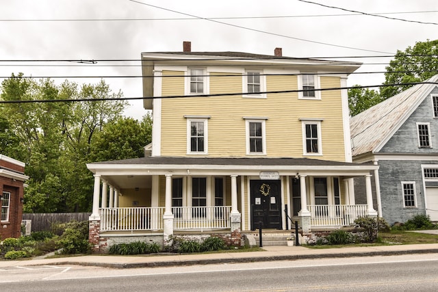 33 Main St, Cornish, ME 04020 - view of front of property with a porch and a chimney