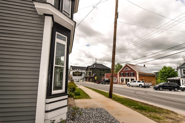 33 Main St, Cornish, ME 04020 - view of asphalt road featuring sidewalks, traffic signs, and a residential view