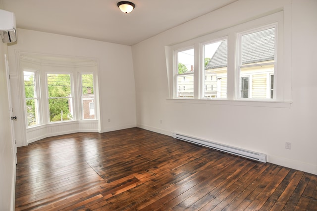 33 Main St, Cornish, ME 04020 - unfurnished room featuring baseboard heating, a wall mounted air conditioner, dark wood-style floors, and baseboards