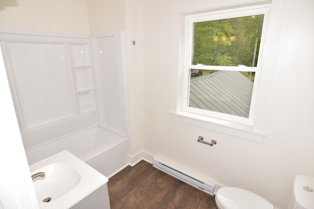 33 Main St, Cornish, ME 04020 - full bath featuring a baseboard radiator, toilet, wood finished floors, vanity, and washtub / shower combination
