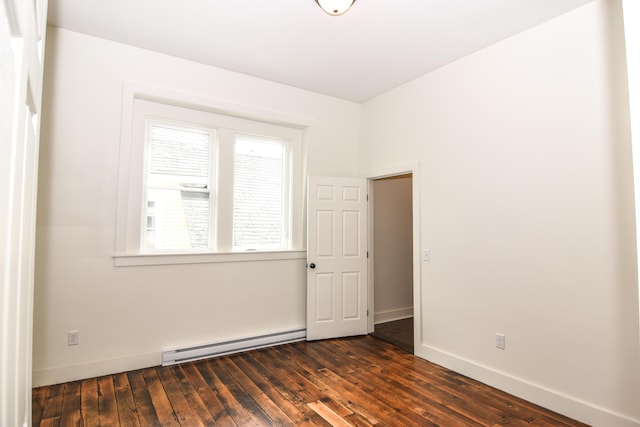 33 Main St, Cornish, ME 04020 - unfurnished room featuring baseboard heating, baseboards, and dark wood-type flooring