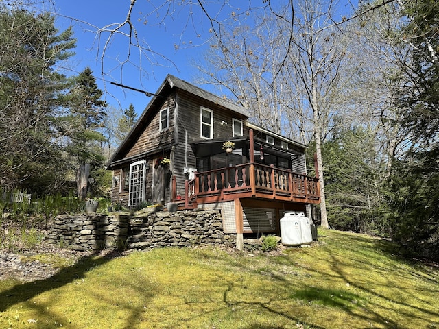 217 Jackson Rd, Monroe, ME 04951 - rear view of property with a wooden deck and a lawn