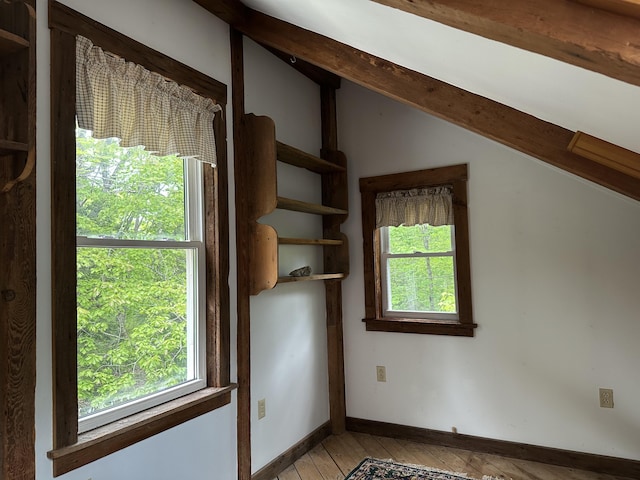 217 Jackson Rd, Monroe, ME 04951 - spare room with lofted ceiling, healthy amount of natural light, light wood-style flooring, and baseboards