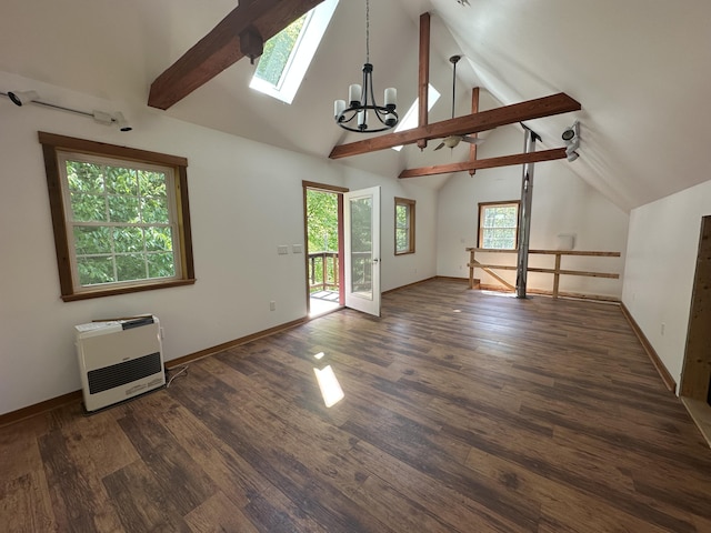 217 Jackson Rd, Monroe, ME 04951 - spare room with heating unit, a chandelier, beamed ceiling, wood finished floors, and a skylight