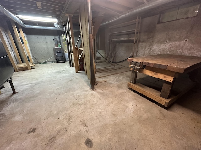 217 Jackson Rd, Monroe, ME 04951 - unfinished below grade area with a wood stove