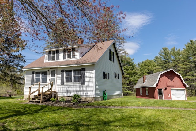 460 Center Dr, Orrington, ME 04474 - view of front of property with a barn, a detached garage, an outbuilding, a front lawn, and entry steps