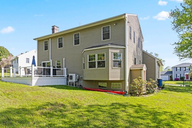 43 W Lynne Ave, Portland, ME 04103 - back of house featuring a chimney, a lawn, ac unit, and a wooden deck