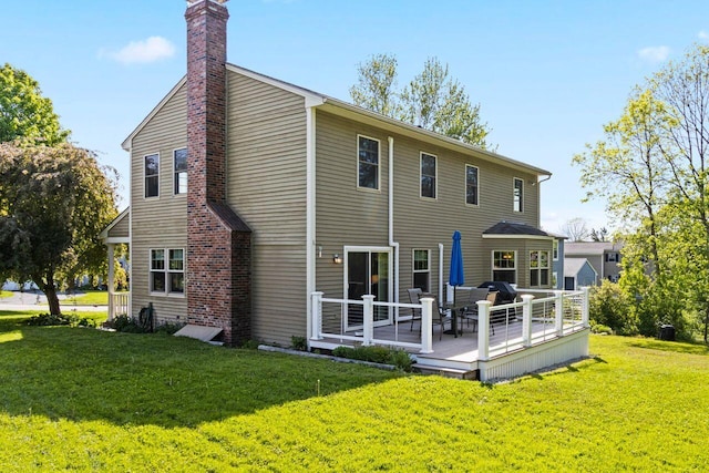 43 W Lynne Ave, Portland, ME 04103 - back of house with a wooden deck, a lawn, and a chimney