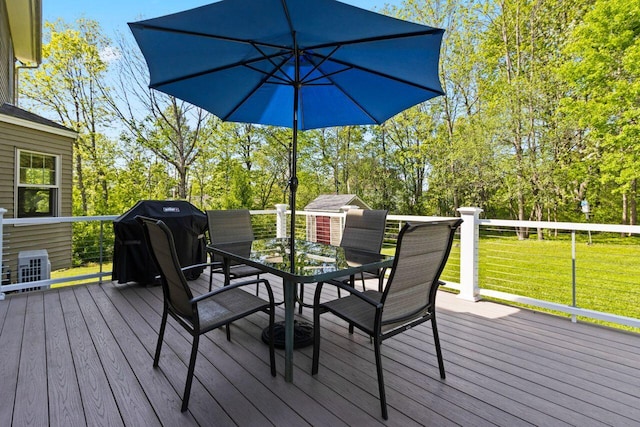 43 W Lynne Ave, Portland, ME 04103 - wooden terrace featuring outdoor dining space, a lawn, area for grilling, and view of scattered trees