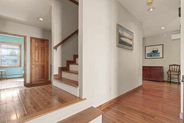 43 W Lynne Ave, Portland, ME 04103 - staircase featuring wood finished floors, a baseboard radiator, baseboards, and recessed lighting