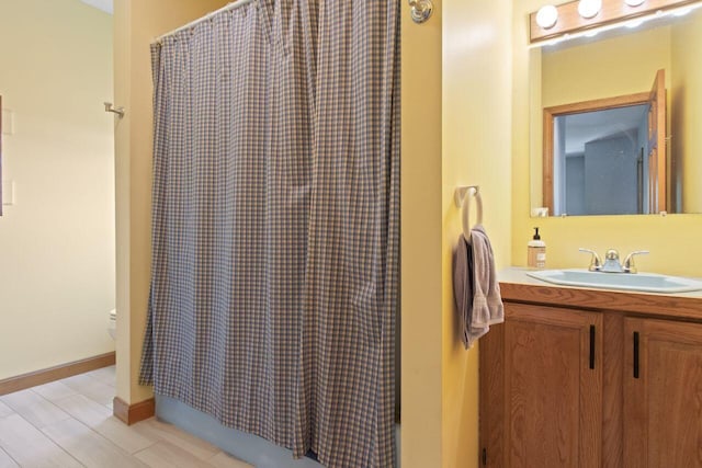 43 W Lynne Ave, Portland, ME 04103 - bathroom featuring vanity, shower / bath combo with shower curtain, and toilet