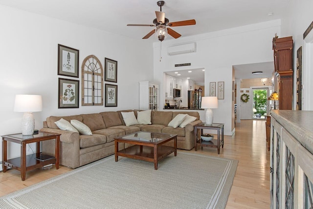 12 Kimberly Ct Unit 1, Portland, ME 04103 - living room featuring light wood-style flooring, a wall mounted AC, and ceiling fan