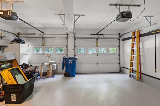 12 Kimberly Ct Unit 1, Portland, ME 04103 - garage with a garage door opener and freestanding refrigerator