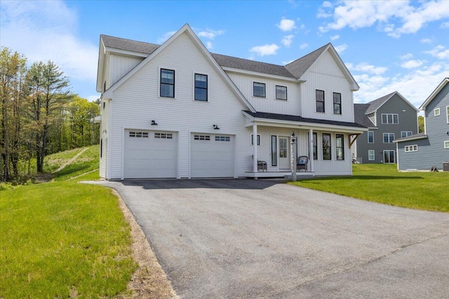 5 Cobblestone St Unit 53, Falmouth, ME 04105 - modern farmhouse style home featuring board and batten siding, an attached garage, covered porch, and asphalt driveway