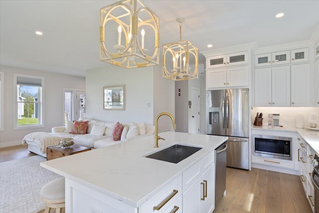 5 Cobblestone St Unit 53, Falmouth, ME 04105 - kitchen featuring stainless steel appliances, a sink, open floor plan, a chandelier, and recessed lighting