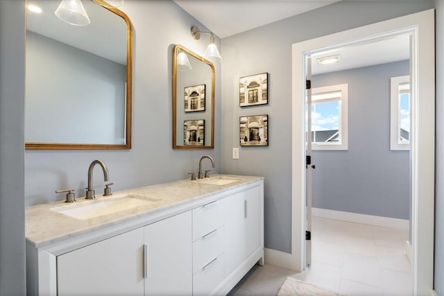 5 Cobblestone St Unit 53, Falmouth, ME 04105 - bathroom with double vanity and baseboards