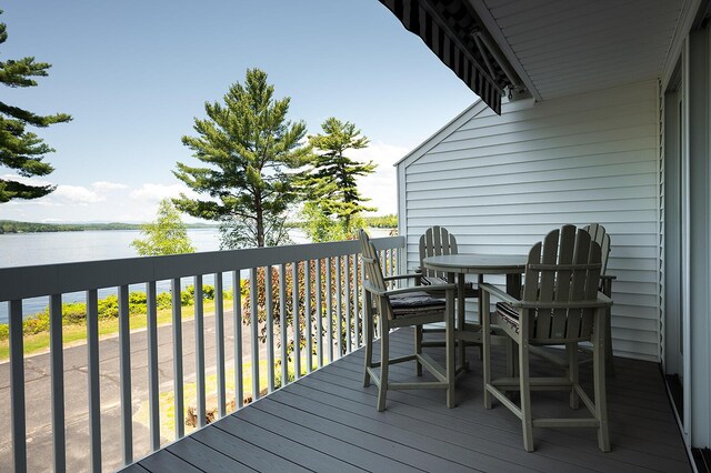 7 Goodridge Dr Unit 7, Naples, ME 04055 - wooden terrace with a water view and outdoor dining area