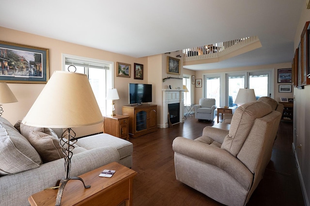 7 Goodridge Dr Unit 7, Naples, ME 04055 - living room featuring a fireplace, healthy amount of natural light, and wood finished floors