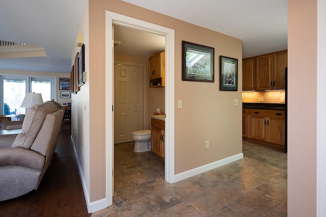 7 Goodridge Dr Unit 7, Naples, ME 04055 - hall featuring baseboards and dark stone finish floors