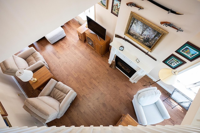 7 Goodridge Dr Unit 7, Naples, ME 04055 - living area with wood finished floors and a fireplace