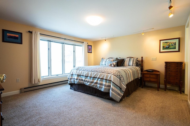 7 Goodridge Dr Unit 7, Naples, ME 04055 - bedroom with a baseboard radiator, track lighting, carpet, and baseboards