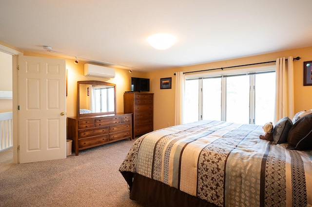 7 Goodridge Dr Unit 7, Naples, ME 04055 - bedroom featuring light carpet and a wall mounted air conditioner