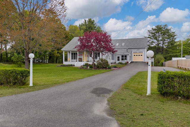 96 Grove St, Lewiston, ME 04240 - view of front facade with an attached garage, asphalt driveway, and a porch