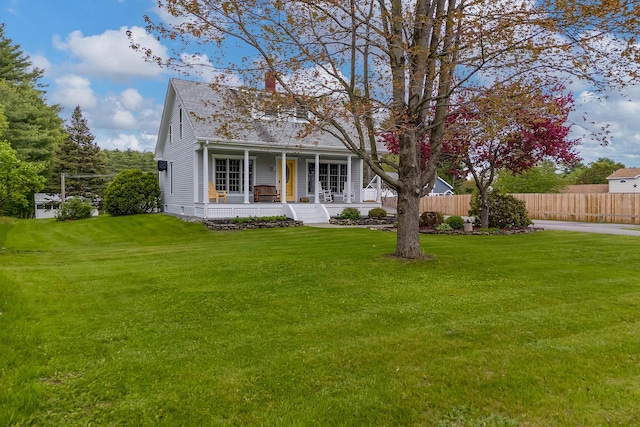 96 Grove St, Lewiston, ME 04240 - view of front of home featuring a porch, a chimney, and roof with shingles