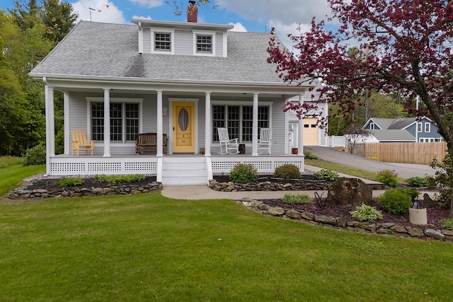 96 Grove St, Lewiston, ME 04240 - view of front of home with a porch, a shingled roof, a chimney, and a garage