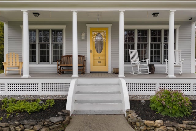 96 Grove St, Lewiston, ME 04240 - doorway to property featuring a porch