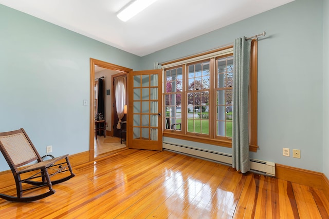 96 Grove St, Lewiston, ME 04240 - unfurnished room featuring light wood-type flooring, baseboard heating, and baseboards
