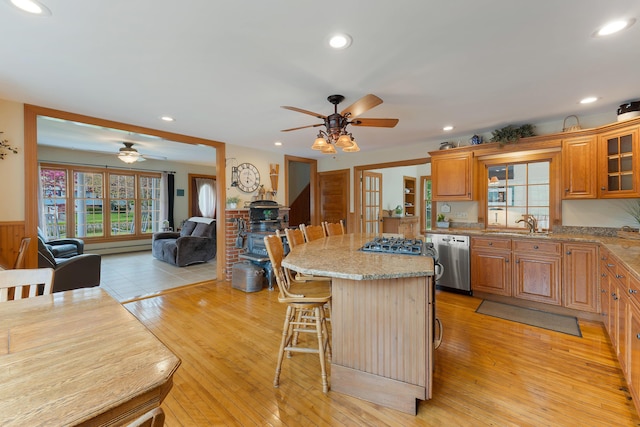 96 Grove St, Lewiston, ME 04240 - kitchen featuring appliances with stainless steel finishes, a ceiling fan, a breakfast bar, open floor plan, and recessed lighting