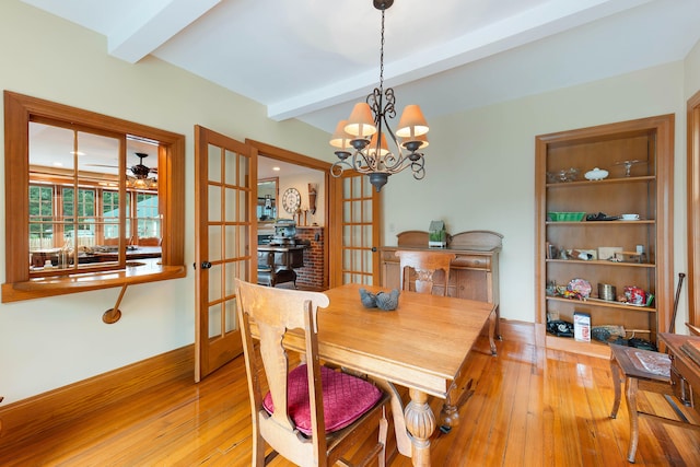 96 Grove St, Lewiston, ME 04240 - dining room with beamed ceiling, hardwood / wood-style floors, baseboards, a chandelier, and french doors