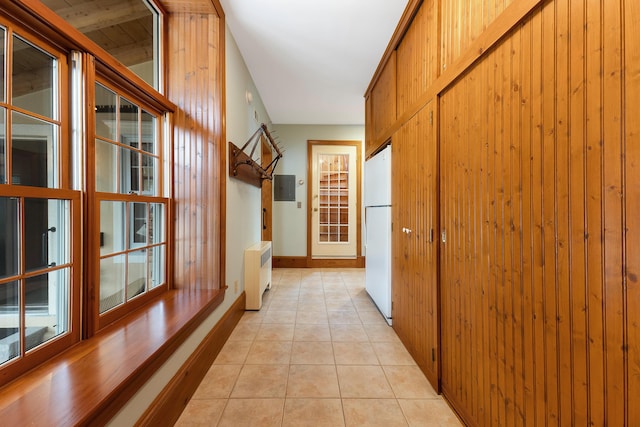 96 Grove St, Lewiston, ME 04240 - hallway with light tile patterned floors, electric panel, baseboards, and radiator