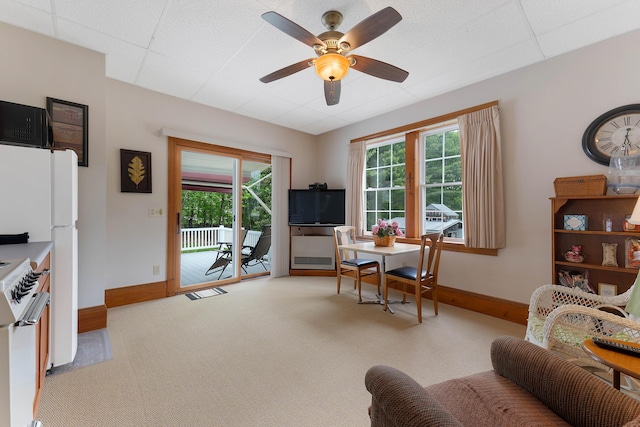 96 Grove St, Lewiston, ME 04240 - living area with baseboards, light carpet, and a ceiling fan