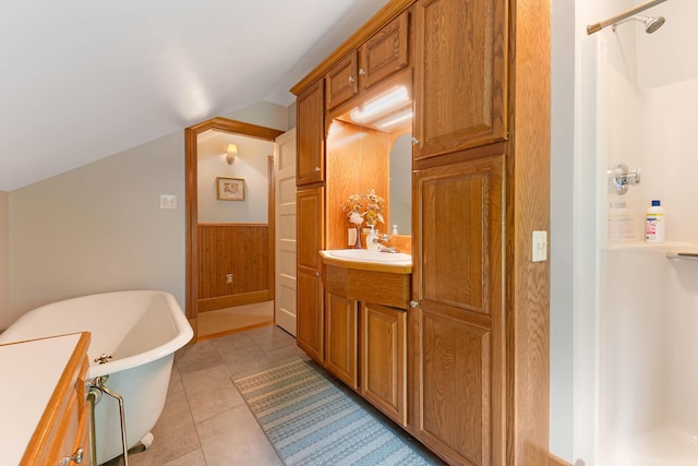 96 Grove St, Lewiston, ME 04240 - bathroom with a stall shower, a freestanding bath, vanity, vaulted ceiling, and wooden walls