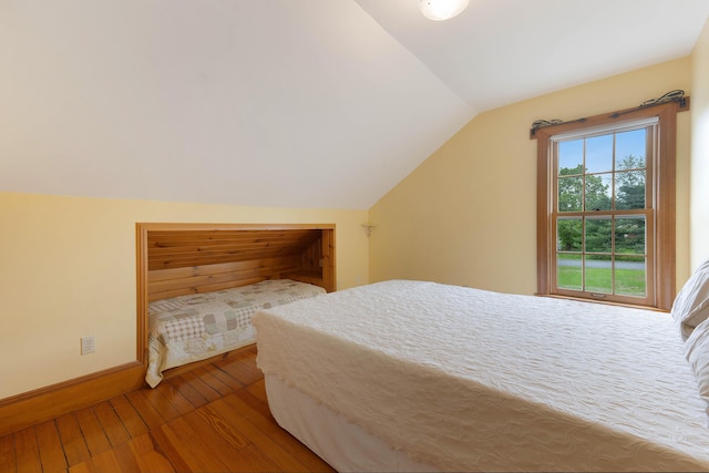 96 Grove St, Lewiston, ME 04240 - bedroom with hardwood / wood-style floors, lofted ceiling, and baseboards