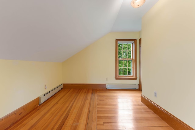 96 Grove St, Lewiston, ME 04240 - bonus room featuring a baseboard heating unit, lofted ceiling, light wood-style floors, and baseboards