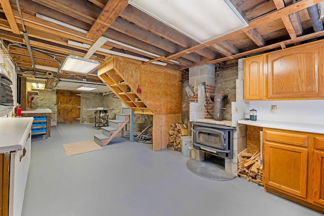 96 Grove St, Lewiston, ME 04240 - unfinished below grade area featuring a wood stove