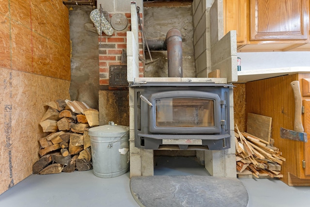 96 Grove St, Lewiston, ME 04240 - detailed view of a wood stove and concrete flooring