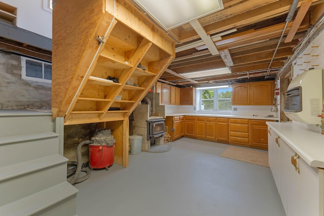 96 Grove St, Lewiston, ME 04240 - below grade area featuring a wood stove