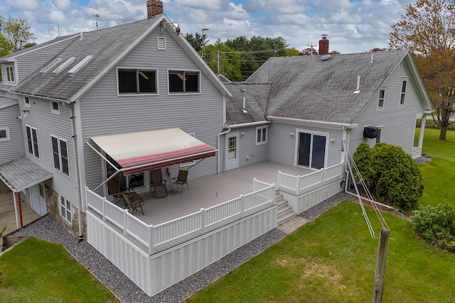 96 Grove St, Lewiston, ME 04240 - rear view of property featuring a chimney, a deck, a lawn, and a shingled roof