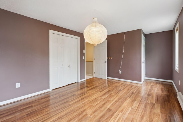 17 Graham Rd Unit 17, Westbrook, ME 04092 - unfurnished bedroom featuring light wood-style flooring, baseboards, and a closet