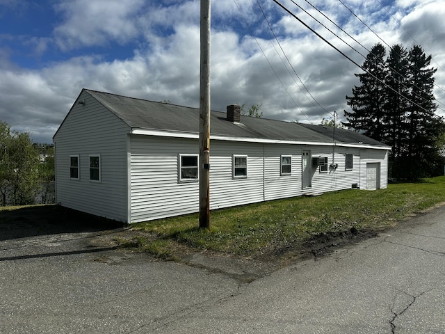 29 Exchange St, Presque Isle, ME 04769 - view of side of property with a chimney