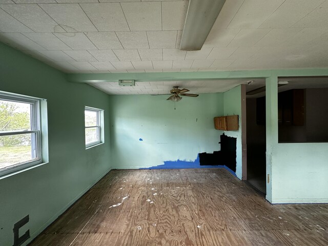 29 Exchange St, Presque Isle, ME 04769 - empty room featuring wood-type flooring, a ceiling fan, and baseboards