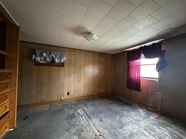 29 Exchange St, Presque Isle, ME 04769 - empty room featuring baseboards and wood walls